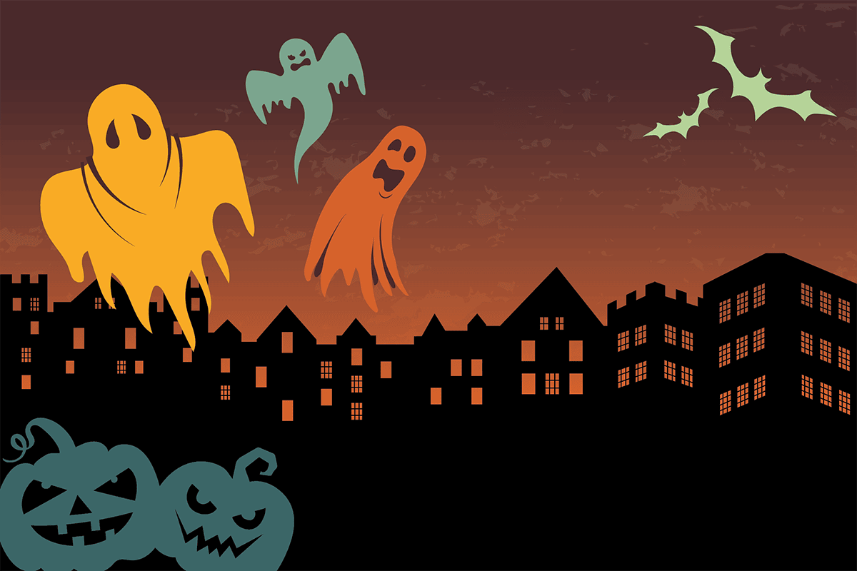 Drawing of colorful ghosts, bats and pumpkins floating in front of a darkened backdrop of Columbia College buildings.