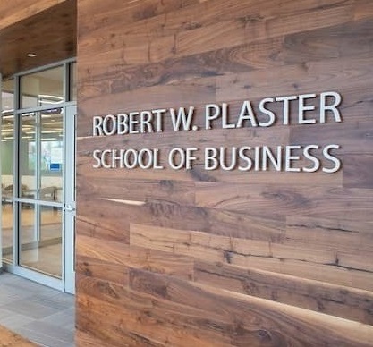 Robert W. Plaster School of Business sign located inside of New Hall.