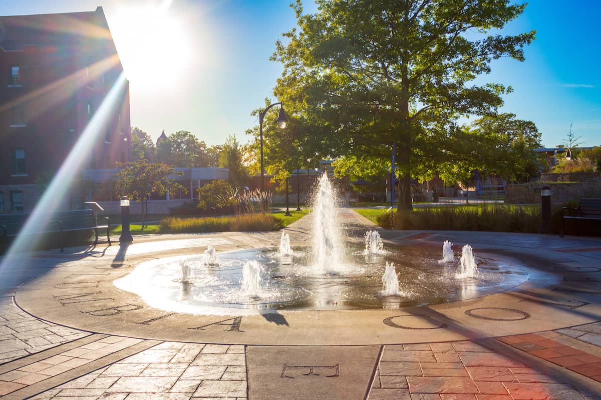 Image of the Quad on Columbia College campus with the water fountain running during summer